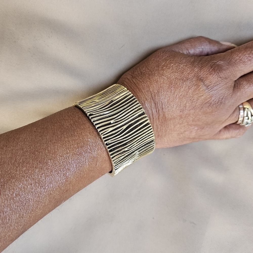 Vintage Black and Gold-tone Hinged Bangle Bracelet
